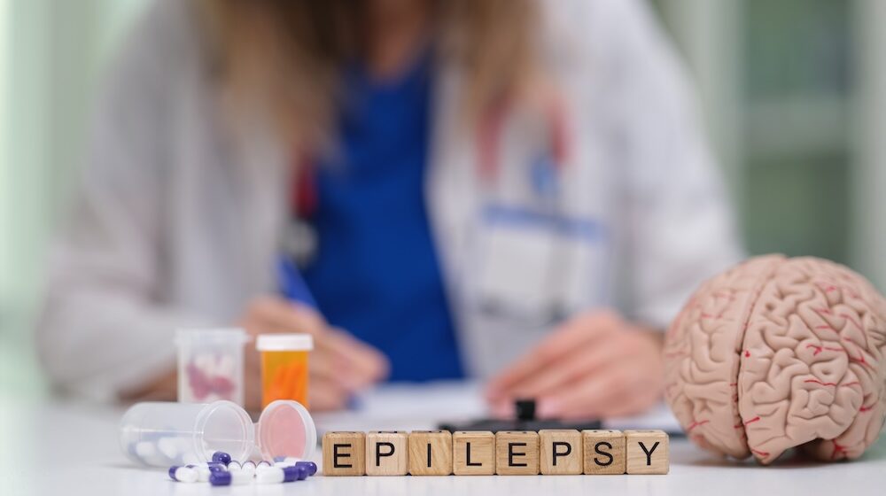 Which factors increase autism risk in children with epilepsy?
